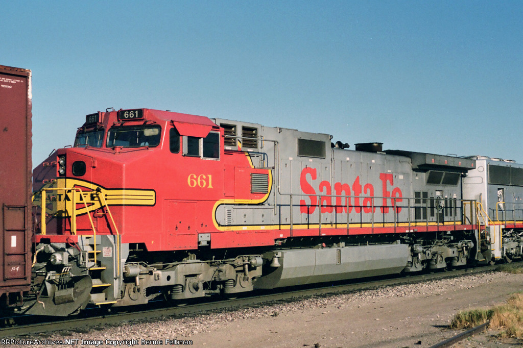 Santa Fe C44-9W #661 trails C44-9W #656 and SD75M #8267 on an eastbound passing the depot 